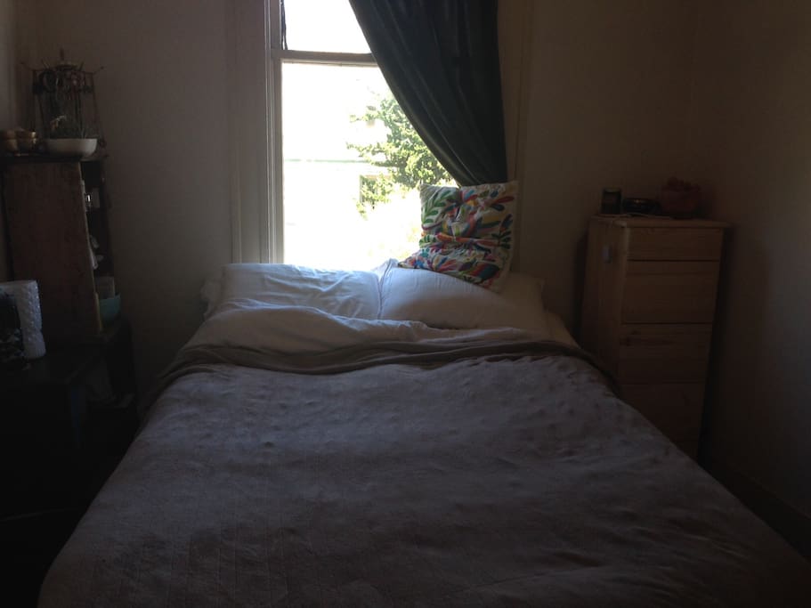 Queen bed with a beautiful window