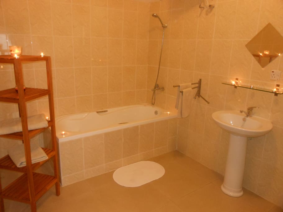 Bathroom with bathtub and hot water