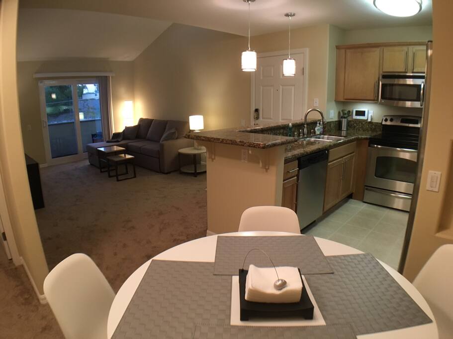 A view from the Dining Area towards the living room & kitchen