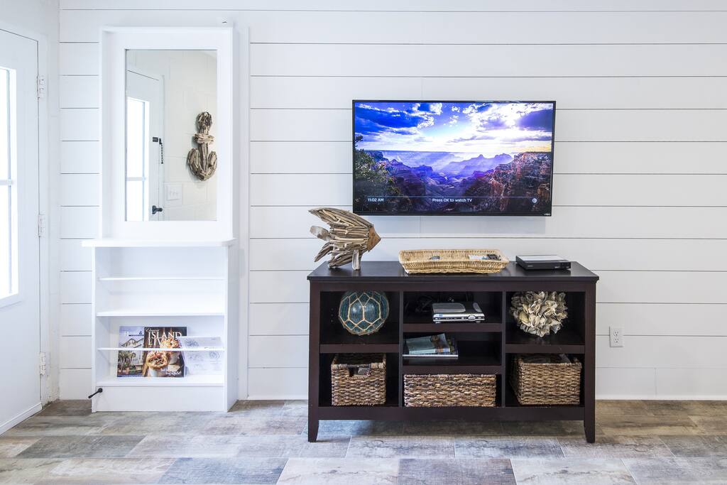 Opposite Wall in living area. Flat Screen TV with dvd and cable