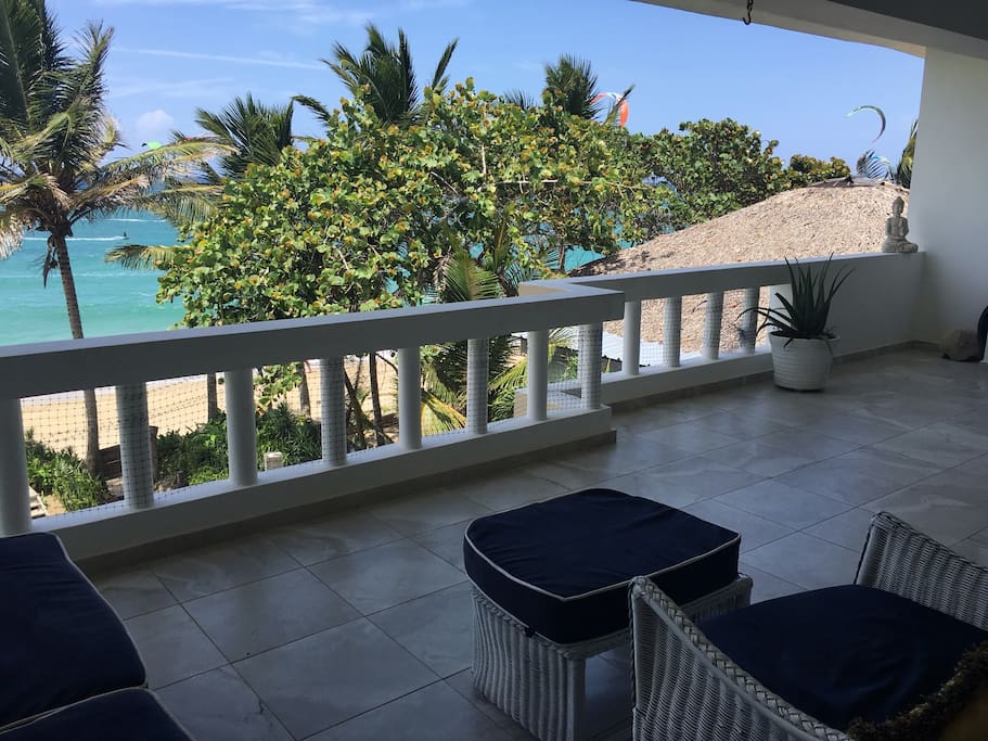 Outdoor terrace with lounge seating and stunning views.