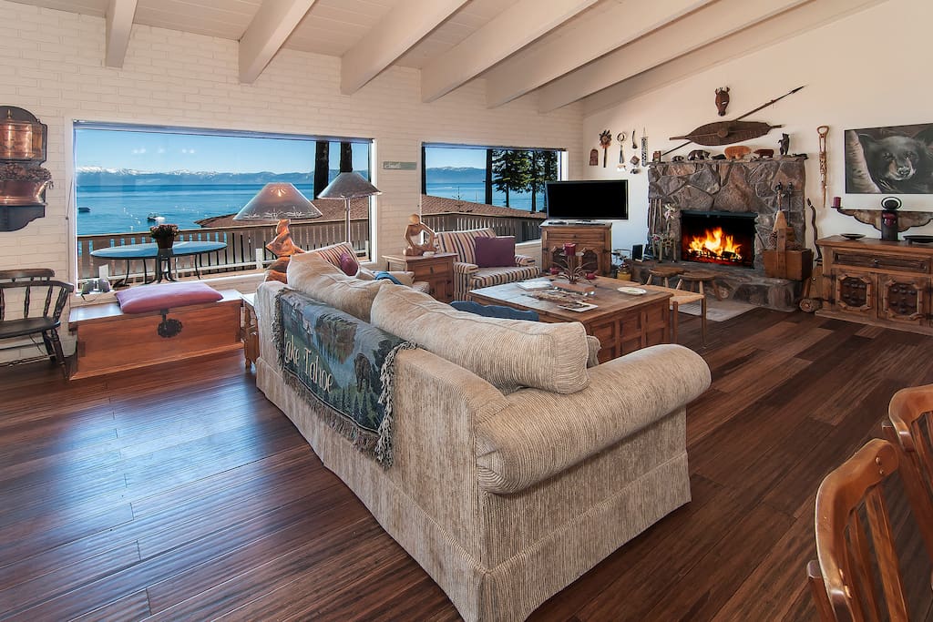 Wood burning fireplace, couch seating for six, and cute Tahoe decorations