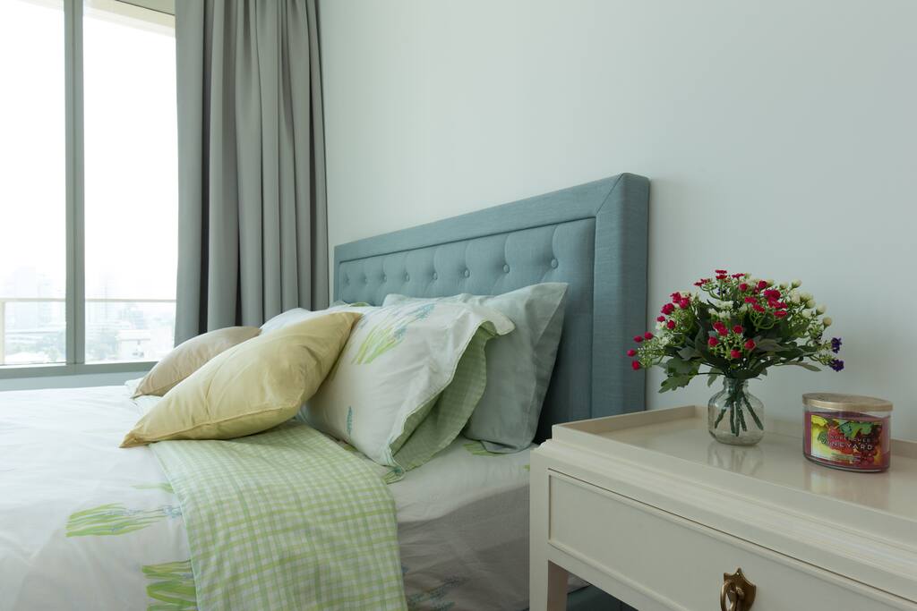 Master bedroom with a city view.