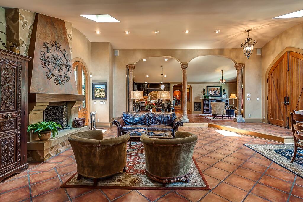 Open and entertaining living room with wood burning fireplace