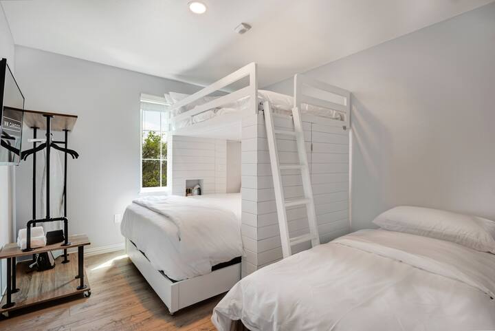All bedrooms feature this custom-designed bunk bed with queen mattress (lower) and double mattress (upper). We can also add a single bed to up to three bedrooms in your unit as pictured here!