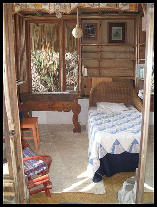 Entrance to lower living area. Sofa and possible 2nd bed. Max 2 people thought.