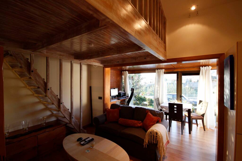 The living room with dining area and desk