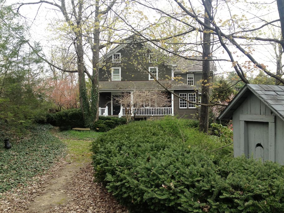 The antique out house and the house beyond