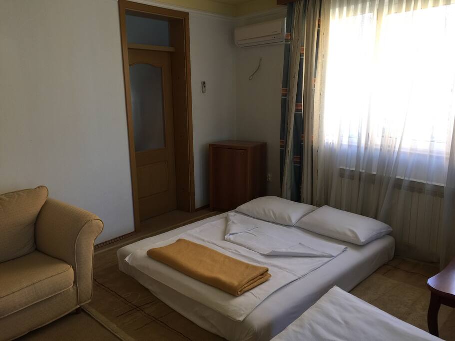 Room 1, 3 beds, 1 french bed and 2 single beds. With aircondition and balkony. Free wi-fi, tv cable, tv satellite.