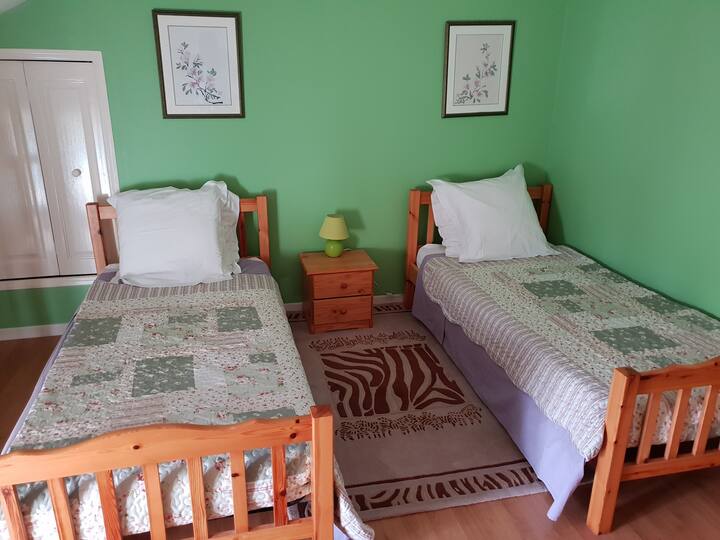 Twin beds located on the first floor  with a child gate or anti parent gate as described by one of our recent young guests