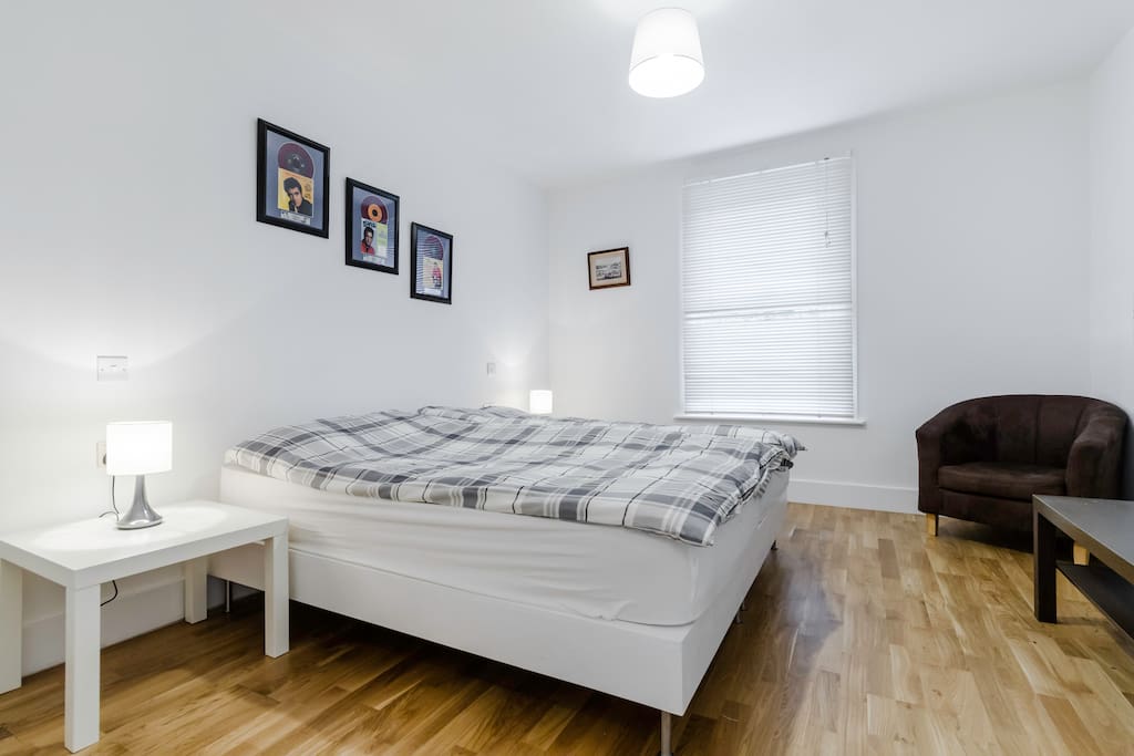 Bright cheery bedroom showing King size Bed.