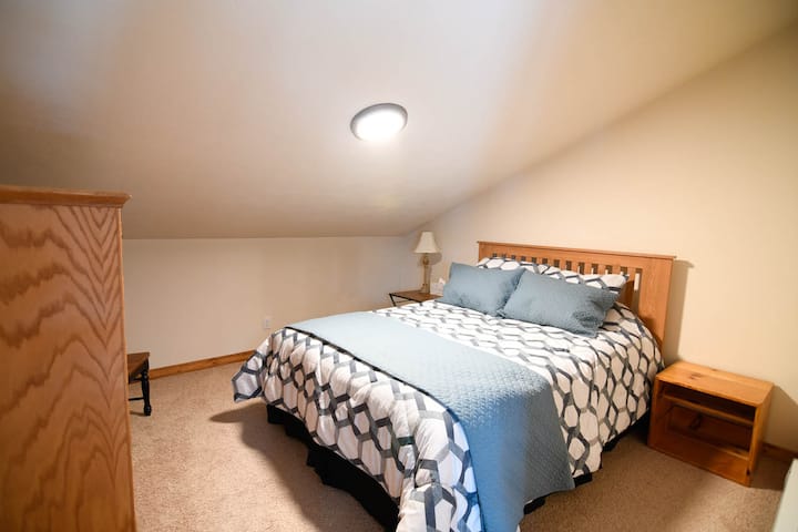 The third bedroom is upstairs with a queen bed located in the loft to rest in preparation for another day on the mountain or by the lake. 