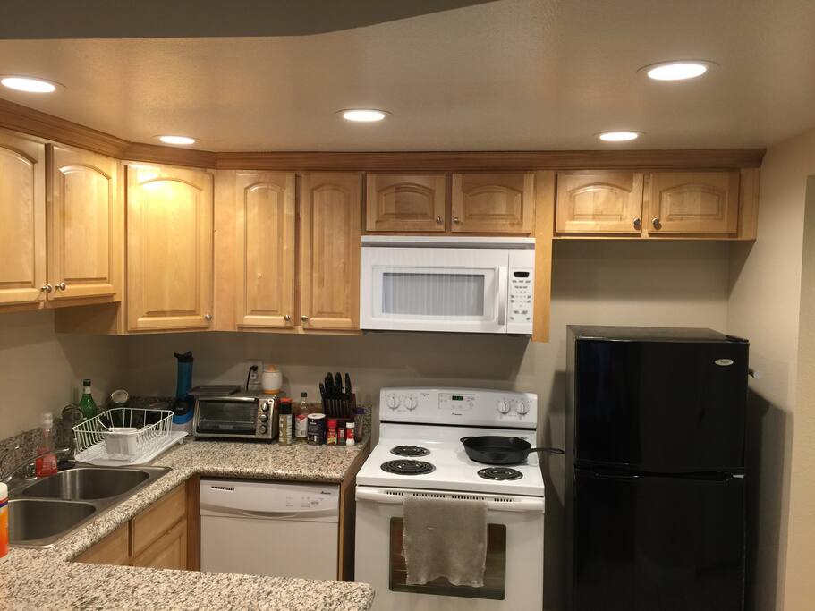 Kitchen with all appliances and plenty of countertop, bar