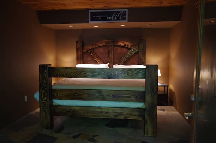 The bed, made by Roy, from local lumber