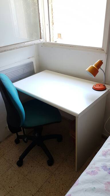 a place to work next to a luminous window just infront of a nice and quite garden