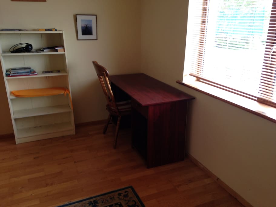 bright room with a desk , another single bed can be added also.