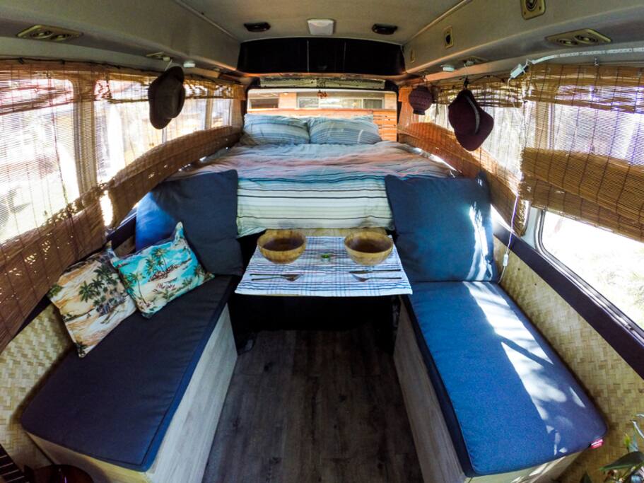 Queen size bed and 2 couches with plenty of storage.