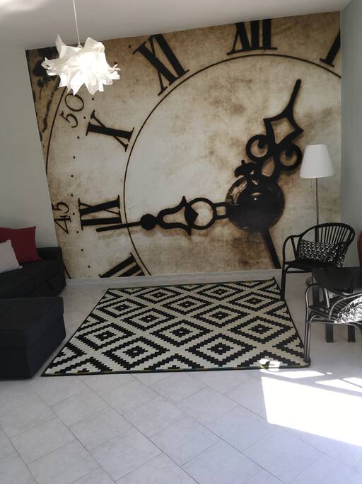 Living and Dining room with a pullout bed - stunning wall feature