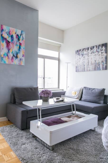 Coffee table can easily be lifted by its sides and converts into a dining table or work space