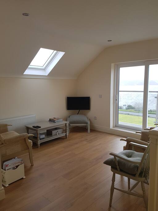 Comfortably furnished living area leading to open balcony
