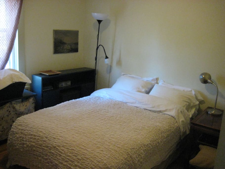main floor - bedroom - queen bed/feather duvet + feather pillows + lots of drawers and closet space + large flat screen TV