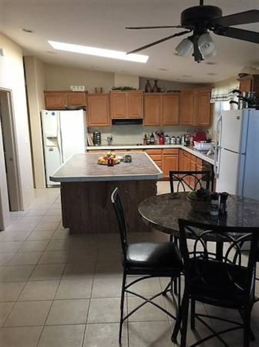 Shared kitchen space with two refrigerators