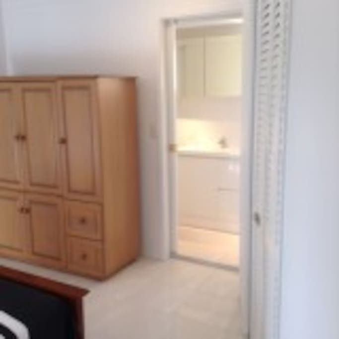 Main bedroom with built in wardrobe, TV and DVD