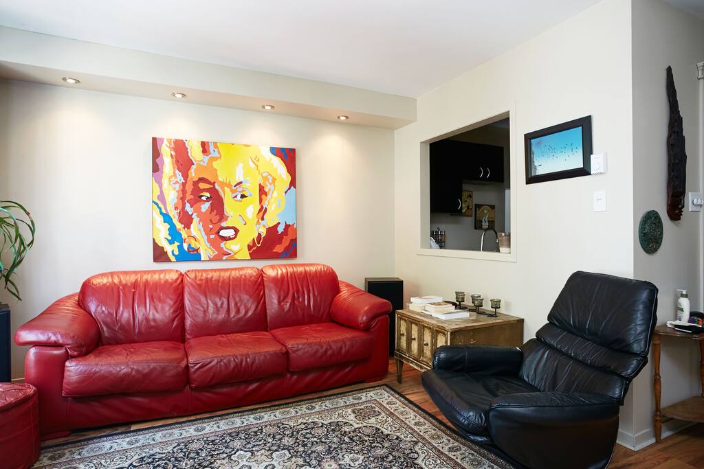 Cozy living room with flat screen tv, leather couches