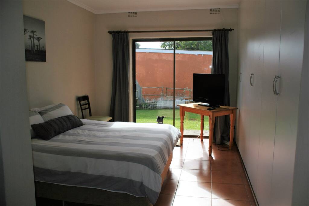 Bedroom viewed from lounge/kitchen with sliding door out to garden