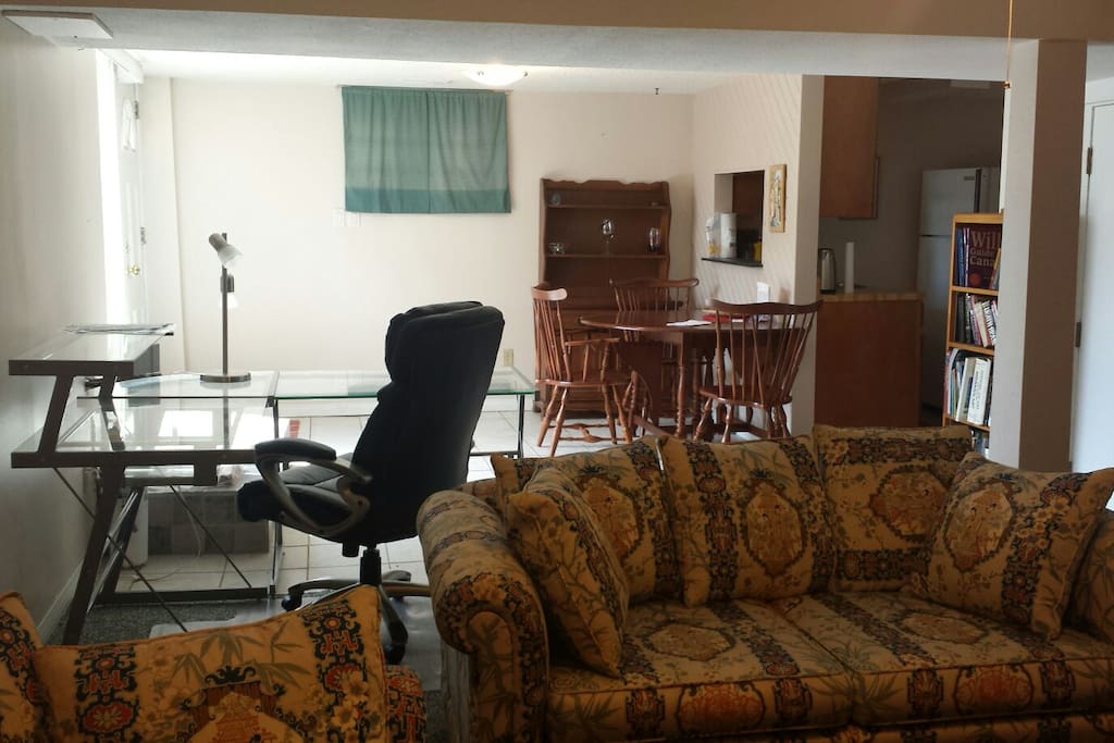 Work desk with dining area in background.