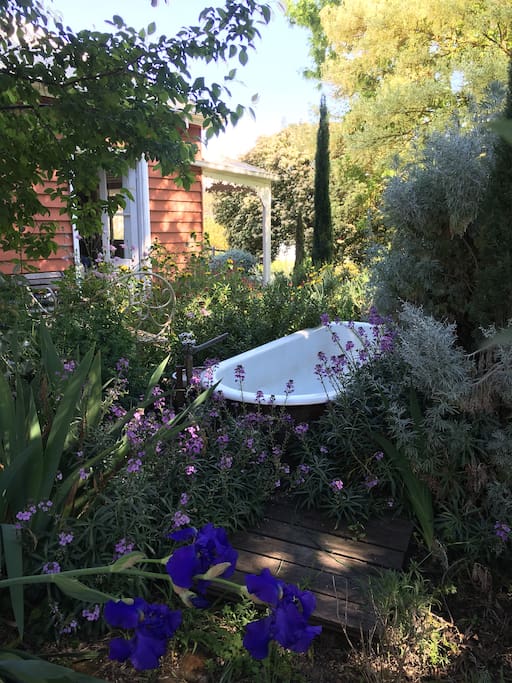 Enjoy our outdoor bath with running hot water surrounded by cottage garden