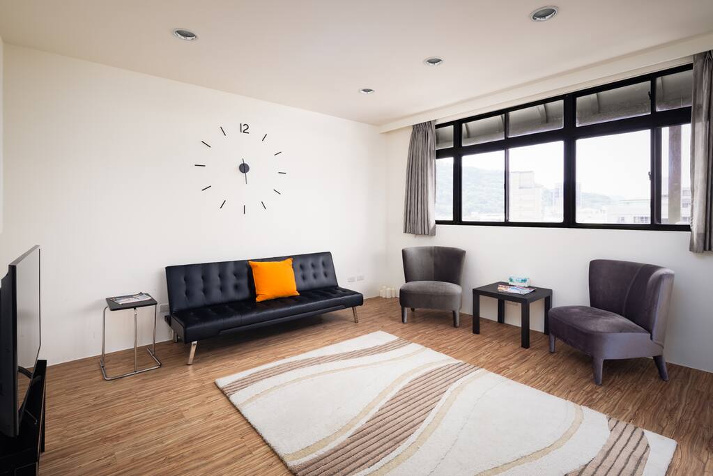 A roomy living room with lots of lighting