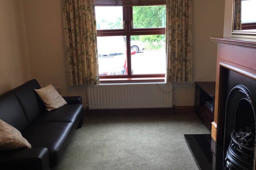 Living room with oil fired central heating and tv