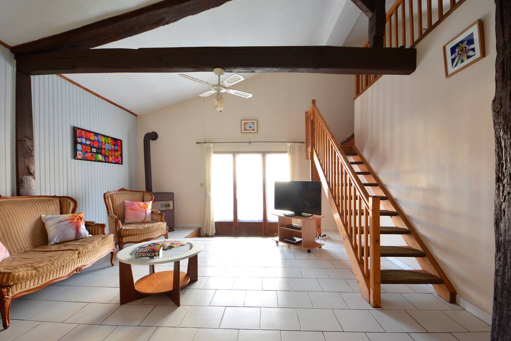 The beautiful lounge, with patio doors leading to your own private garden.