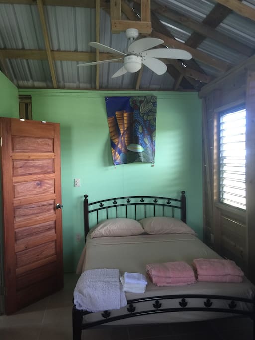 Charming belizean construction. Galvanized roof, open beam ceiling.