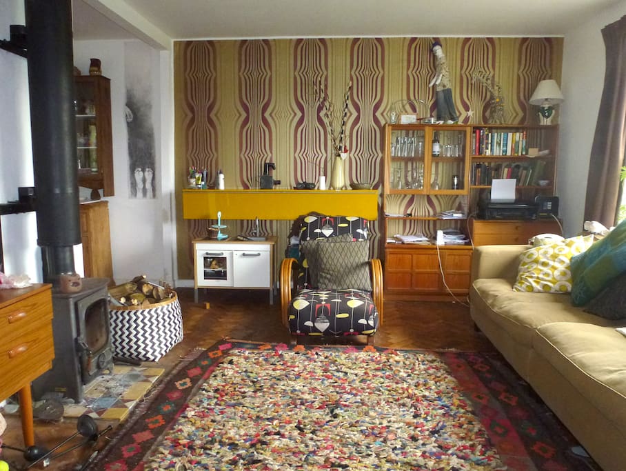 Warm, homely living room in a mishmash of retro furniture