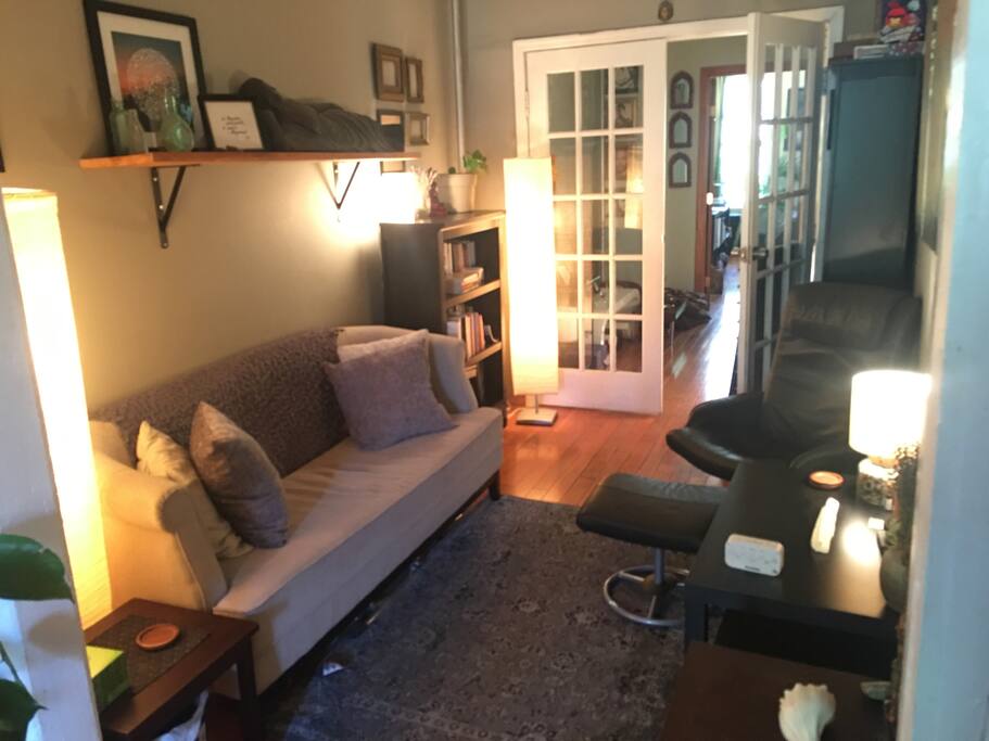 Living room, adjacent to the kitchen, What you'd walk in the door to.