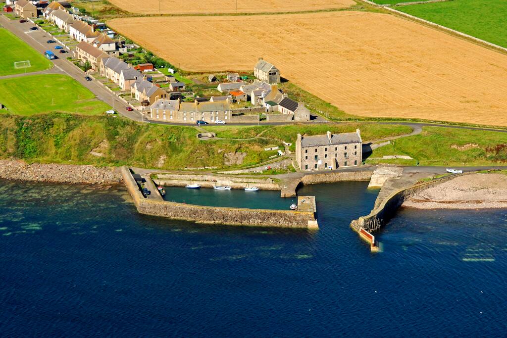 Aerial view of the house nestled in the harbour.