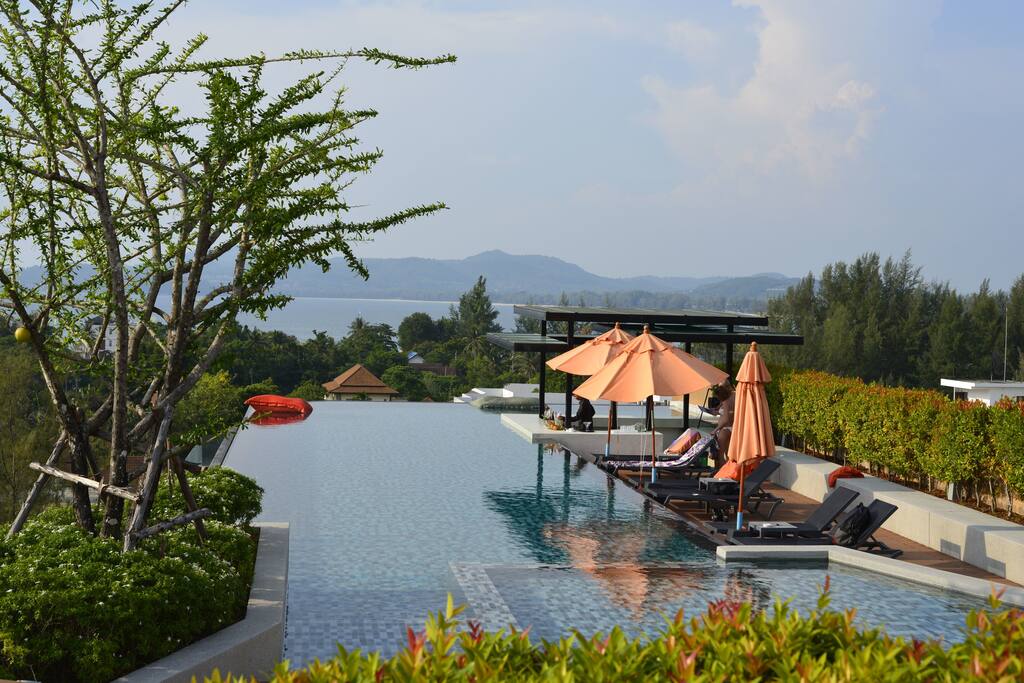 A large swimming pool with sea view
