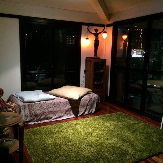 Day bed top level off kitchen/wrap around balcony outside. 2nd living area.