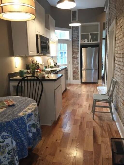 Awesome kitchen!! Love the exposed brick :-)