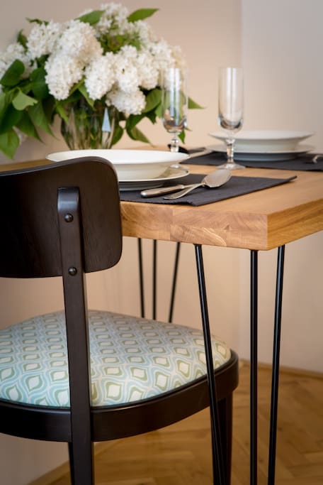 Wooden table, retro chair, dishes available.