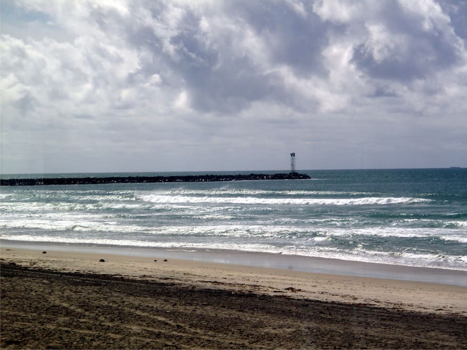view looking south towards the jetty on a rainy day