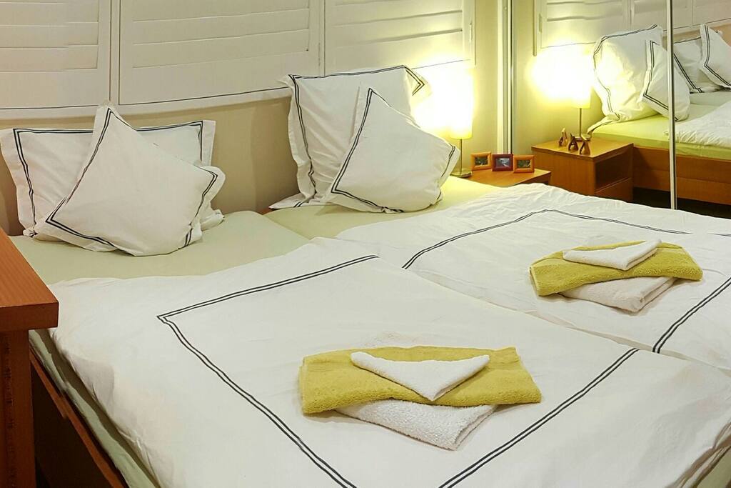 Bedroom with big mirrored wardrobe, desk, German style duvets (2 single king size)