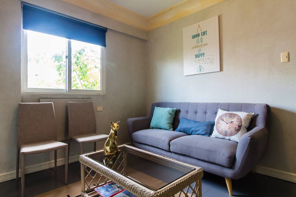 Living room area with TV (not seen in photo)