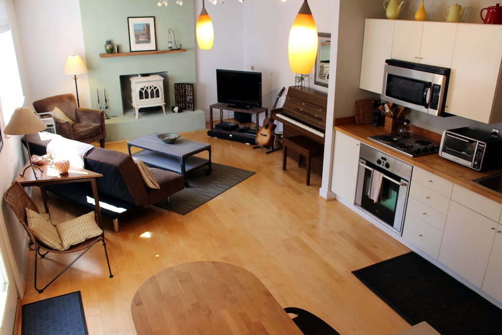 Large space includes kitchen, living and dining space.