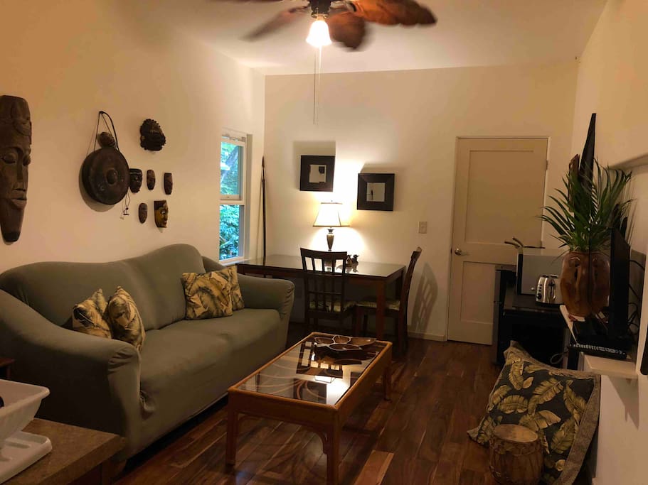 Enjoy your own private suite/studio in paradise. The living area has a comfortable couch and TV area and is also equipped with a mini refrigerator, Nuwave cooktop, and toaster.