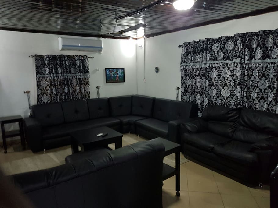 Wide expansive sitting room, with 10 to 12 seater sofa chairs, fully air conditioned with also ceiling fan, centre table, leg rest and multiple side/coffee table. Digital satellite TV with full package for view. Wifi in vantage points in the house.