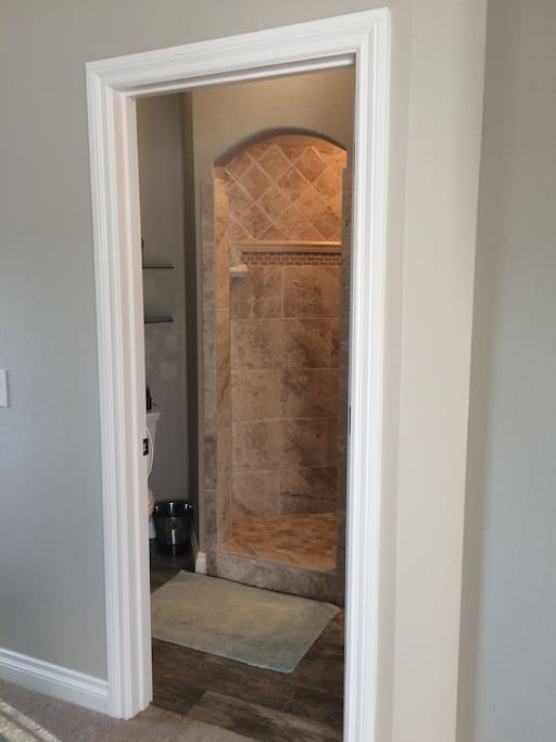 Bathroom with large shower and vanity