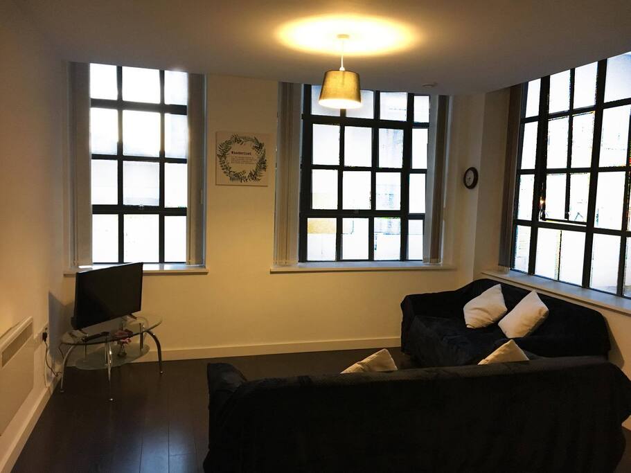Spacious living area with Smart TV and two comfy sofas
